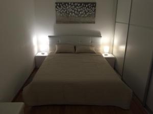 Łóżko lub łóżka w pokoju w obiekcie Marimar apartments
