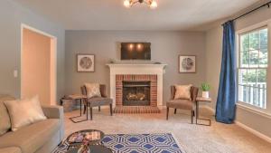 a living room with a couch and a fireplace at Best of the Blue Ridge by AvantStay A Location in Royal Pines