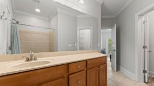a bathroom with a sink and a mirror at Lakefront 6BDR Priv Dock Game Room Firepit Jakes Lake House by Avantstay in Westport +58 photos