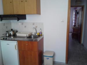 Kuchyň nebo kuchyňský kout v ubytování Liossis Rooms & Apartments + 34 fotografií