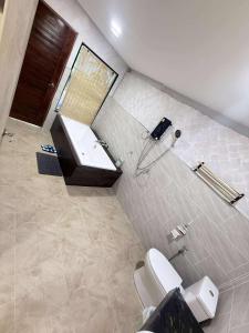 a bathroom with a toilet and a sink at BanrabianglayLangsuan room C in Ban Hin Sam Kon