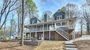 a large house with a porch and a balcony at Porch Paradise by AvantStay New Pool Firepit in Mooresville