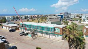 an aerial view of a city with a blue building at 2 Pools Beach Boardwalk Access Studio Sleeps 5 Beach Bungalow by AvantStay in Port Aransas