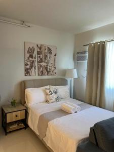 Ένα ή περισσότερα κρεβάτια σε δωμάτιο στο Camella Manors Verdant Condominium By DE Admin