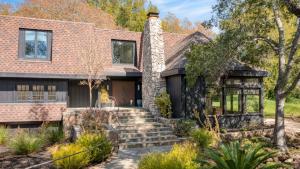 a brick house with a stone chimney at Malvasia by AvantStay Luxe Wine Country Retreat in Santa Rosa