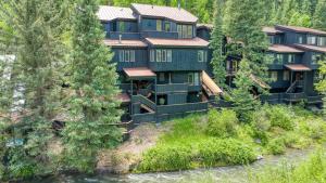an aerial view of a resort with trees at Manitou Riverhouse 115 by AvantStay Spacious Condo in the Centre of Telluride in Telluride