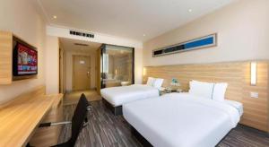 Postel nebo postele na pokoji v ubytování City Comfort Inn Jingmen Zhongjian Jinxiang Square + 120 fotografií