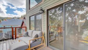 a screened in porch with a chair on a balcony at Quittin Time Townhouse Peaceful Mountain Ski-In-Ski-Out Retreat Close to Town in Park City