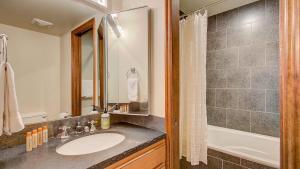 a bathroom with a sink and a shower at Quittin Time Townhouse Peaceful Mountain Ski-In-Ski-Out Retreat Close to Town in Park City +16 photos