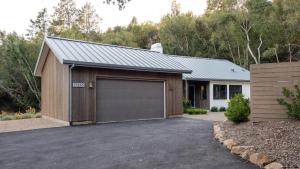 a house with a garage in front of a driveway at Syrah by AvantStay Hilltop Haven in Sonoma Private Pool Patio in Sonoma