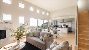 a living room with a couch and a table at Seascape by AvantStay Spacious Contemporary Oasis in Del Mar in San Diego