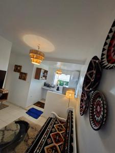 a living room with two chairs and a table at Essaouira Stay with private Terrace in Essaouira
