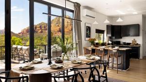 a kitchen and living room with a table and chairs at Roca Roja by AvantStay Mountain Views in the Heart of Sedona in Sedona