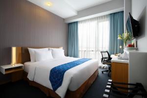 Katil atau katil-katil dalam bilik di Hotel Grandhika Setiabudi Medan
