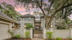 a house with a tree in front of it at Hilton Ivory 15th Hole of Harbourtown Golf Course Private Pool Hot Tub in Hilton Head Island
