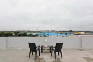 a table and two chairs on a roof at Azura Vista by Alt Acco in Pune