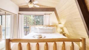 a bedroom with a bed with a hat on it at Alder by AvantStay Moody Retreat: Patio Hot Tub in Sunriver in Sunriver