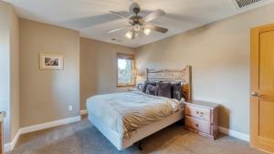 a bedroom with a bed and a ceiling fan at Luxe All-Season Retreat by AvantStay Prime Location Near Skiing in Truckee
