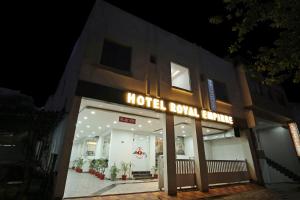 a hotel room entrance with a sign in the night at Collection O Royal Empire in Chandīgarh