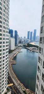 a view of a river in a city with buildings at Marine City Cozy Stay in Busan