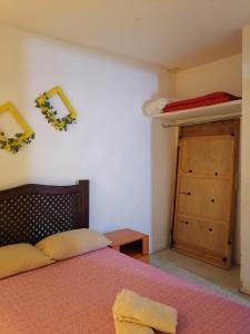 Ένα ή περισσότερα κρεβάτια σε δωμάτιο στο Casa Ambar Aire acondicionado y FACTURA