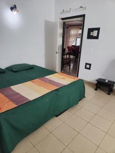 a bedroom with a bed and a living room at Hansa Villa in Bentota
