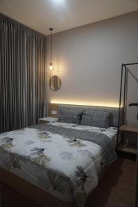 a bedroom with a large bed in a room at Villa Caldera C6 Batu in Tlekung