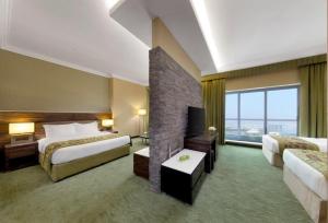Postelja oz. postelje v sobi nastanitve Atana Hotel + 23 fotografij