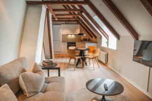 a living room with a couch and a table at Hotel Scheelsminde in Aalborg
