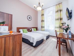 Posteľ alebo postele v izbe v ubytovaní Apartamenty Bonerowska 5