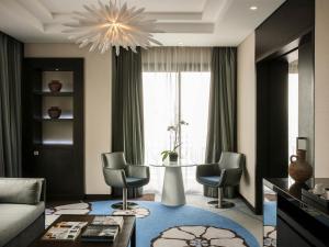 a living room with a couch and chairs and a table at Sofitel Beirut Le Gabriel in Beirut