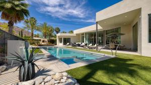 a swimming pool in the backyard of a house at Villa Valentina by AvantStay Pool Hot Tub Views Luxury Design in Palm Springs