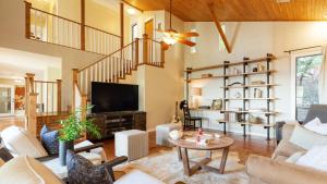 a living room filled with furniture and a tv at Dawson by AvantStay Serene Austin Home set Amongst nature w Pool Close to Lake Travis in Austin