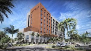 a rendering of a hotel with cars parked in front of it at Hyatt Place Cancun Airport in Cancún