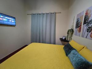 Rúm í herbergi á Hotel Casona Macondo, Granada, Nicaragua