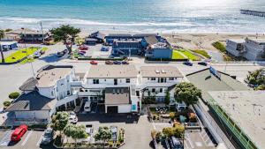 an aerial view of a house next to the beach at 2 Cayucan Bungalows Steps to Beach Shared Lounge Sleeps 12 in Cayucos