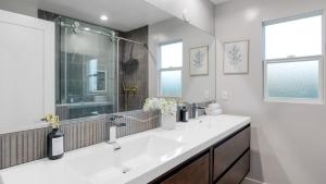 a white bathroom with a sink and a shower at Fulton Buyout by AvantStay Sherman Oaks Estate View in Los Angeles +60 photos