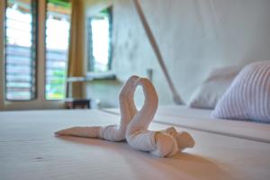 Postel nebo postele na pokoji v ubytování Kinondo Poa Beach Resort
