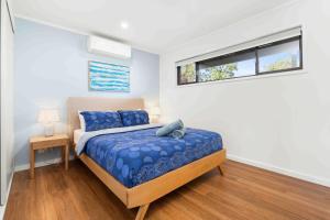 Postel nebo postele na pokoji v ubytování Baxter's Beach House by Experience Jervis Bay