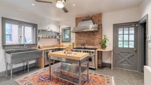 a kitchen with a sink and a stove at Beatrice by AvantStay Charming Catskills Escape in Catskill