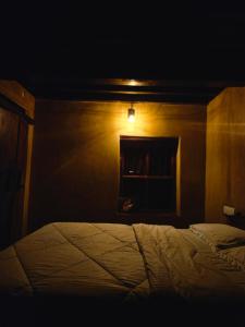 A bed or beds in a room at Aravanazhi tharavadu