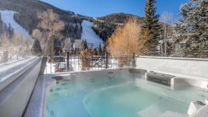 a hot tub with a view of a snowy mountain at Telluride Lodge 312 by AvantStay Close to Slopes Town in Telluride +5 photos