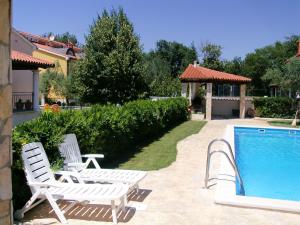 Der Swimmingpool an oder in der Nähe von Oliva Holiday Apartment