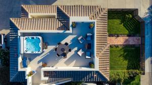 an overhead view of a house with a swimming pool at Sunset Serenity by AvantStay Rooftop w Hot Tub Fire Pit 3 Blocks to Beach in Pismo Beach