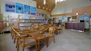 a room with a table and chairs in a store at Frontier Sunrise in Kami-furano