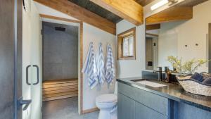 a bathroom with a toilet and a sink at Lazy River Glamp-House by AvantStay Newly Built Luxe Indoor-Outdoor Living in La Pine +48 photos
