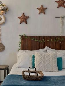 a bedroom with a bed with stars on the wall at CasaMarena in Isla Mujeres