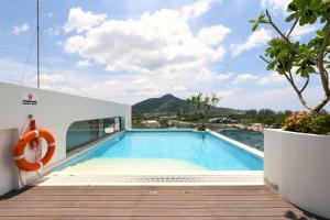 a swimming pool on the roof of a house at Fantasea Condo Kamala A209 2BDRM by Phuket Sabay Rent in Kamala Beach