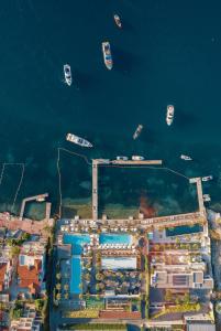 an aerial view of a city with boats in the water at Monte Palm Beach in Tivat