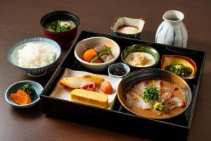 a tray filled with different types of food on a table at Mars Garden Hotel Hakata in Fukuoka